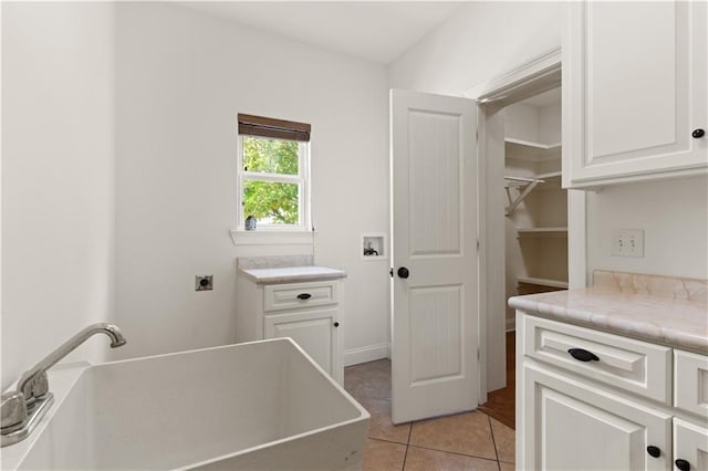 114 Wedge Wood Ct, Brunswick, GA 31525 - washroom with electric dryer hookup, light tile patterned flooring, hookup for a washing machine, and cabinet space