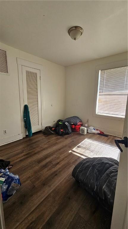 2645 Oriole St, Brunswick, GA 31520 - unfurnished bedroom with visible vents and wood finished floors