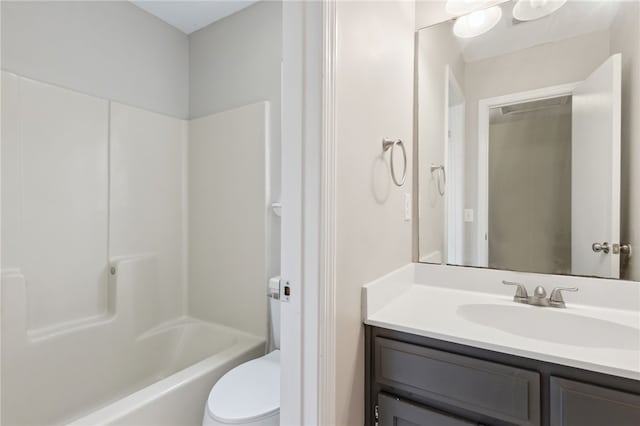 full bathroom featuring vanity,  shower combination, and toilet