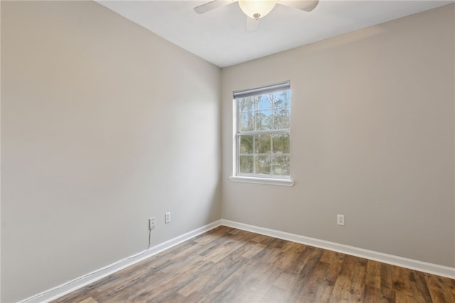 spare room with hardwood / wood-style flooring and ceiling fan