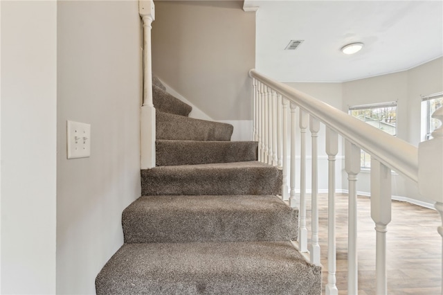 staircase featuring hardwood / wood-style flooring