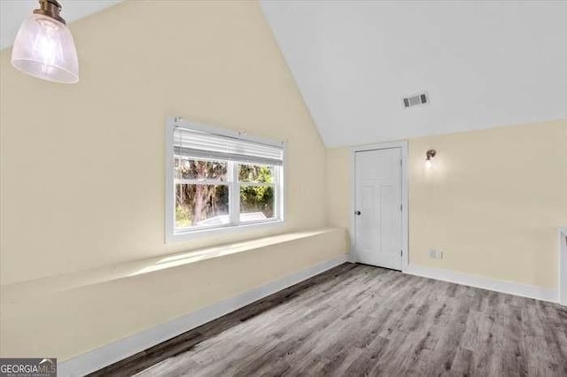 bonus room featuring hardwood / wood-style flooring and lofted ceiling