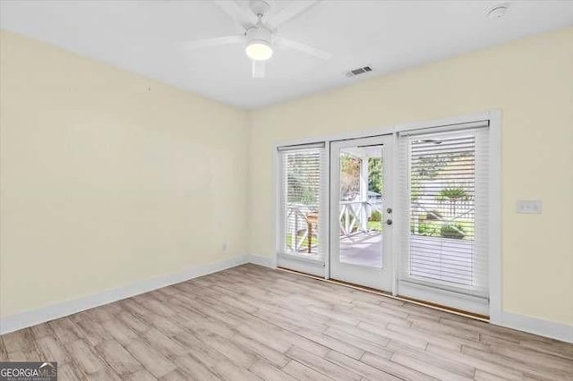 unfurnished room featuring french doors, light hardwood / wood-style floors, and ceiling fan