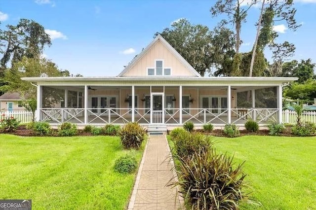 back of house with a lawn