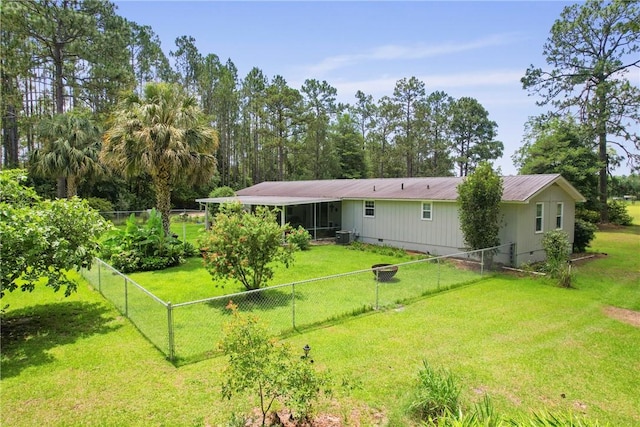 314 King David Rd, Jesup, GA 31545 - rear view of property with crawl space, a fenced backyard, and a metal roof