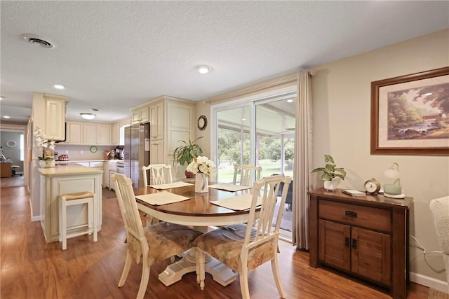 314 King David Rd, Jesup, GA 31545 - dining area with light wood-type flooring, a textured ceiling, and recessed lighting