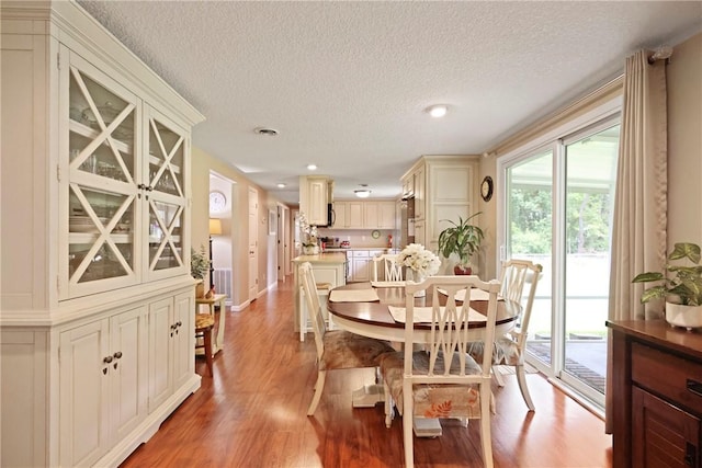314 King David Rd, Jesup, GA 31545 - dining room with a textured ceiling, light wood-type flooring, and recessed lighting