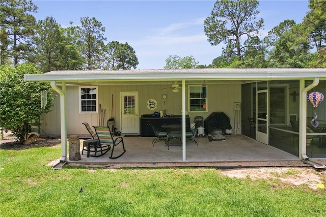 314 King David Rd, Jesup, GA 31545 - back of property with a ceiling fan, a yard, a patio, and a metal roof