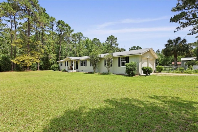 314 King David Rd, Jesup, GA 31545 - view of front of home featuring an attached garage and a front yard