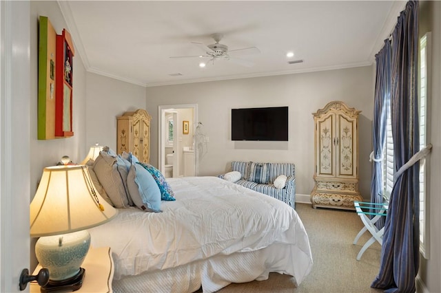 carpeted bedroom featuring ensuite bath, ceiling fan, and ornamental molding