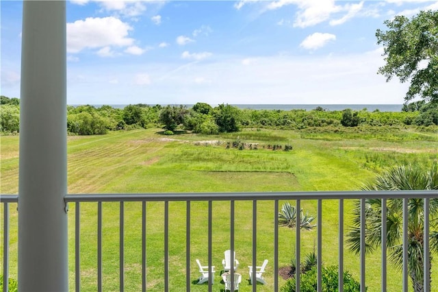 exterior space with a rural view and a balcony