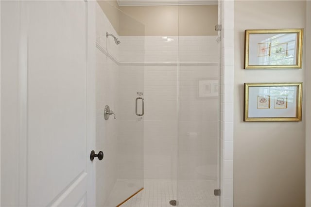 bathroom with a shower with door