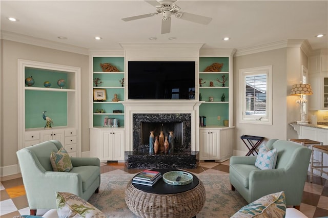 tiled living room with crown molding, a fireplace, ceiling fan, and built in features