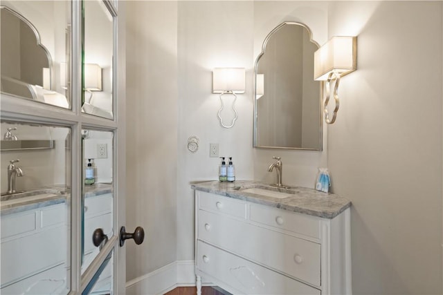 bathroom featuring vanity and wood-type flooring