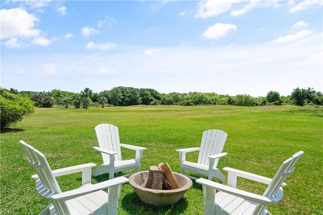 view of yard with a rural view and an outdoor fire pit