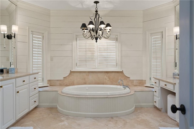 bathroom with a washtub, vanity, crown molding, a chandelier, and wood walls