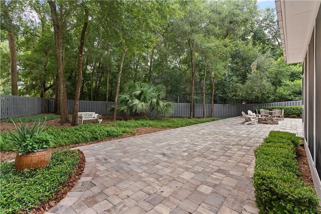 surrounding community featuring a patio and a fenced backyard