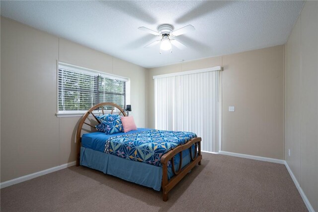 4068 3r Fish Camp Rd, White Oak, GA 31568 - bedroom featuring carpet flooring, a textured ceiling, baseboards, and ceiling fan
