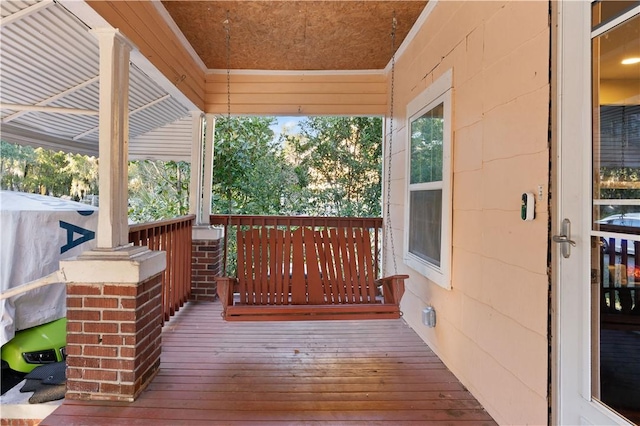 wooden terrace with a porch