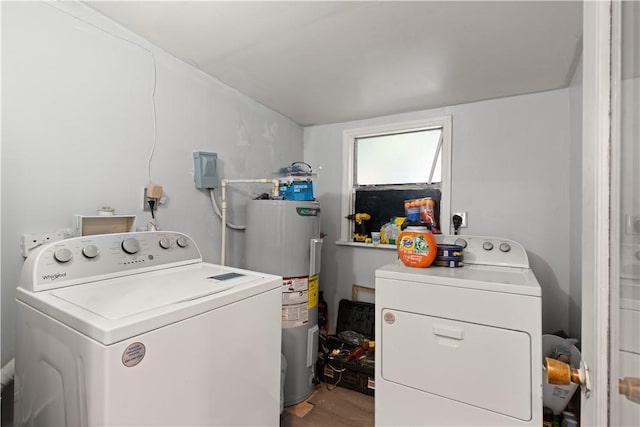 laundry area with water heater and independent washer and dryer