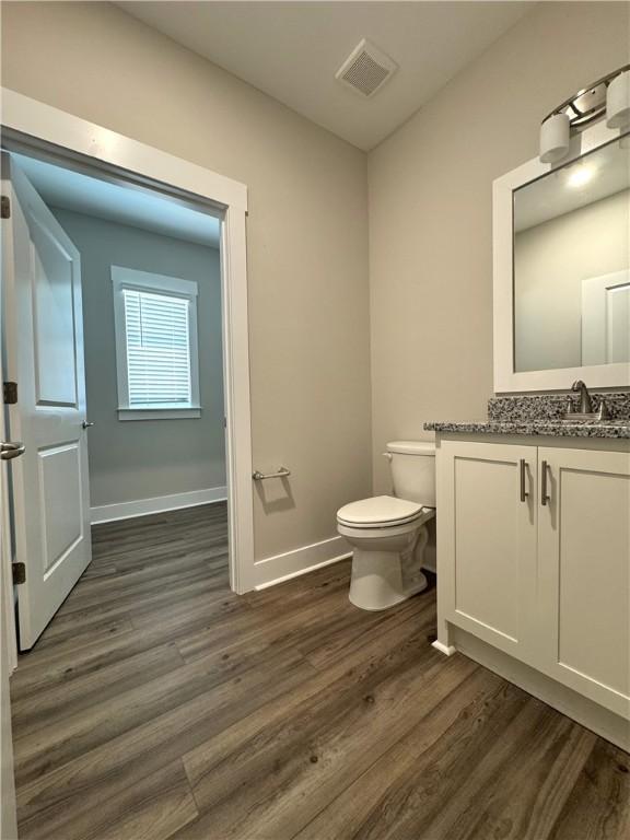 193 W Melody Dr, Jesup, GA 31545 - bathroom with wood finished floors and vanity