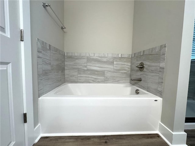 193 W Melody Dr, Jesup, GA 31545 - bathroom featuring a garden tub and wood finished floors