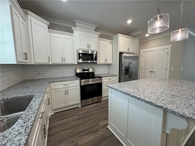 193 W Melody Dr, Jesup, GA 31545 - kitchen featuring stainless steel appliances, ornamental molding, white cabinets, dark wood-type flooring, and recessed lighting