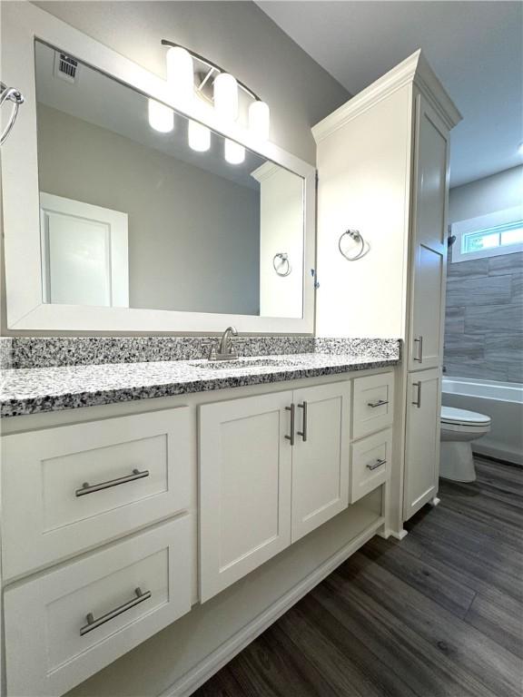 193 W Melody Dr, Jesup, GA 31545 - full bath with vanity and wood finished floors