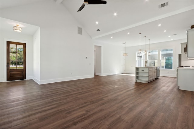 unfurnished living room with ceiling fan, sink, high vaulted ceiling, and dark hardwood / wood-style floors