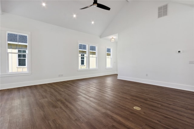 unfurnished room featuring dark hardwood / wood-style floors, high vaulted ceiling, ceiling fan, and a healthy amount of sunlight