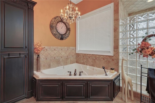655 Littlefield St, Jesup, GA 31546 - bathroom with a chandelier and a bath