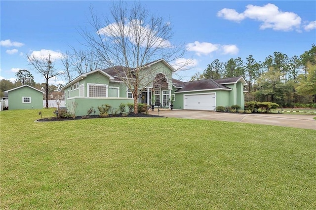 655 Littlefield St, Jesup, GA 31546 - single story home with concrete driveway, an attached garage, a front yard, and stucco siding