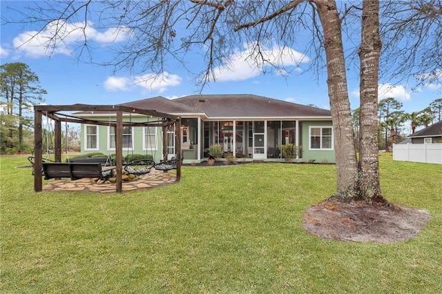 655 Littlefield St, Jesup, GA 31546 - back of house featuring a sunroom, a jacuzzi, and a patio