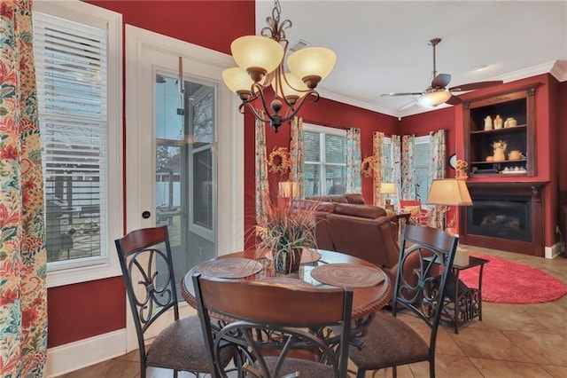 655 Littlefield St, Jesup, GA 31546 - dining space with ornamental molding, tile patterned floors, ceiling fan, a chandelier, and a fireplace