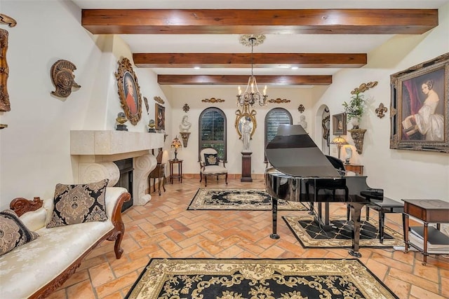 265 Harbor Pointe Dr, Brunswick, GA 31523 - sitting room featuring beamed ceiling, a chandelier, and a large fireplace