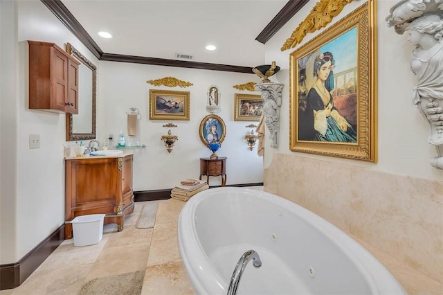 265 Harbor Pointe Dr, Brunswick, GA 31523 - full bath featuring ornamental molding, a tub with jets, vanity, recessed lighting, and baseboards