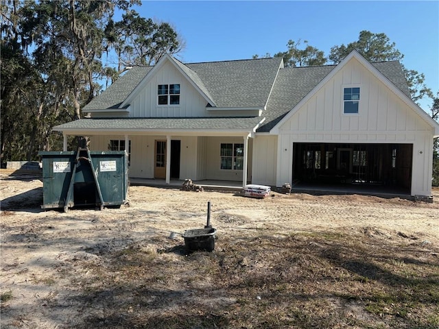 view of front of property featuring a porch and a garage