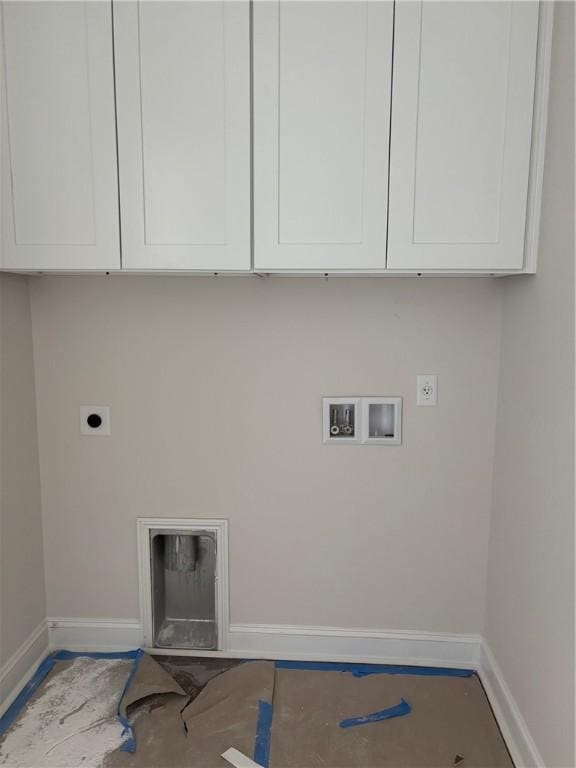 washroom with cabinets, washer hookup, and hookup for an electric dryer