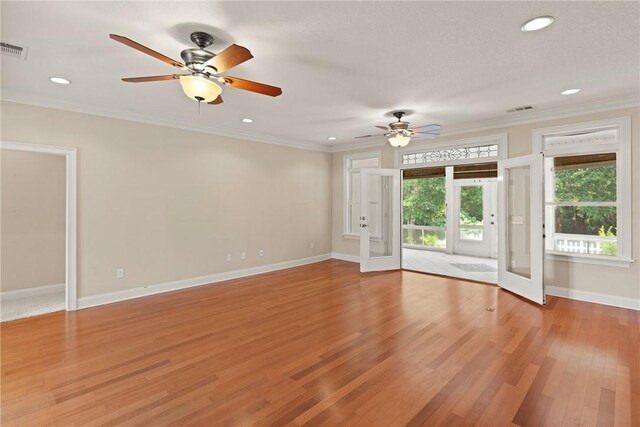 127 Clipper Bay Rd, Brunswick, GA 31523 - unfurnished living room with a ceiling fan, light wood-type flooring, baseboards, recessed lighting, and ornamental molding