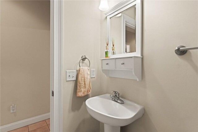 127 Clipper Bay Rd, Brunswick, GA 31523 - bathroom featuring a sink, tile patterned floors, and baseboards