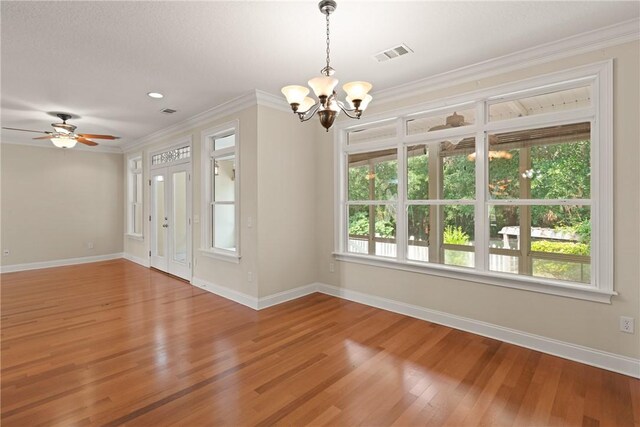 127 Clipper Bay Rd, Brunswick, GA 31523 - empty room with a chandelier, wood finished floors, baseboards, crown molding, and ceiling fan