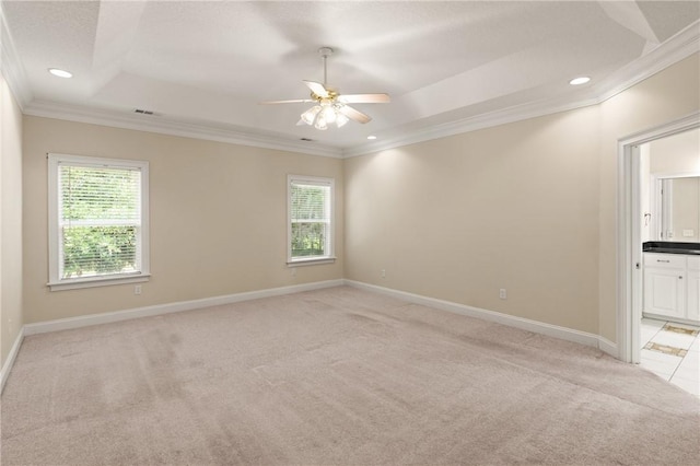 127 Clipper Bay Rd, Brunswick, GA 31523 - spare room featuring light carpet, plenty of natural light, ornamental molding, a tray ceiling, and ceiling fan