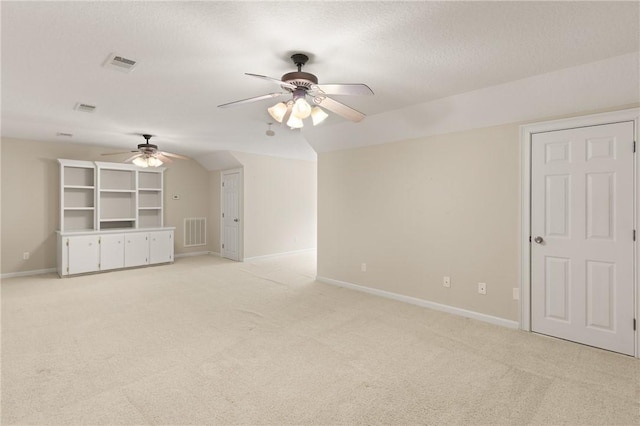 127 Clipper Bay Rd, Brunswick, GA 31523 - unfurnished living room featuring ceiling fan, light colored carpet, baseboards, and a textured ceiling