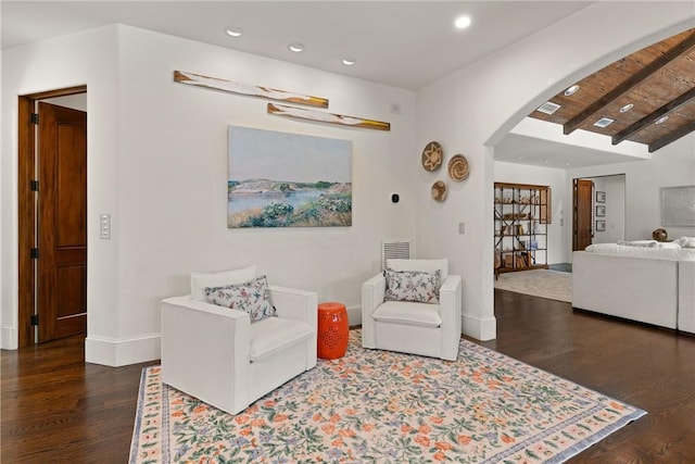 sitting room with recessed lighting, visible vents, baseboards, arched walkways, and wood finished floors