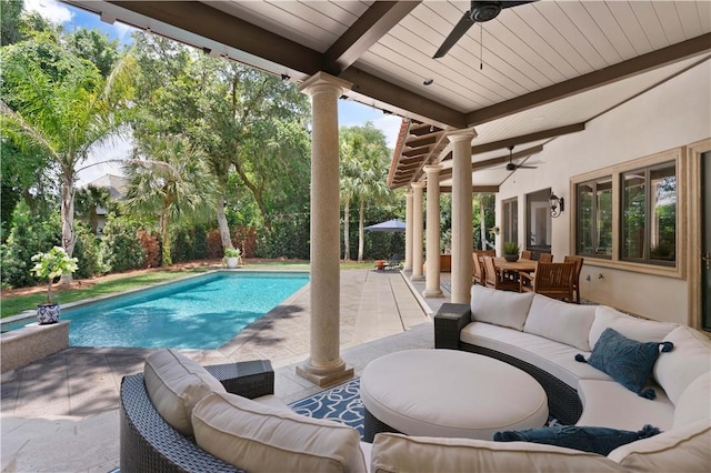 outdoor pool with an outdoor living space, ceiling fan, outdoor dining area, and a patio area