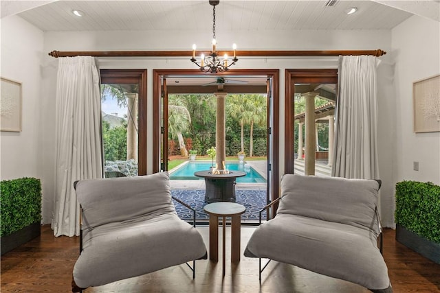 sitting room with recessed lighting, wood finished floors, a notable chandelier, and wood ceiling