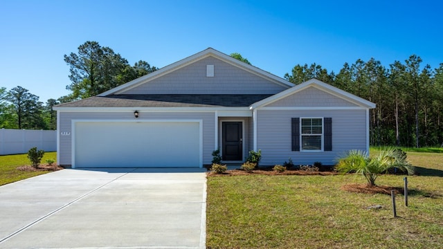 view of front of property with a garage and a front lawn