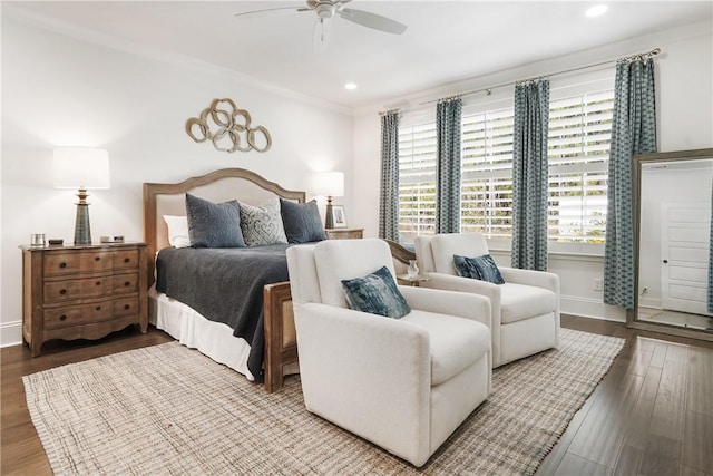 bedroom featuring hardwood / wood-style flooring and ceiling fan