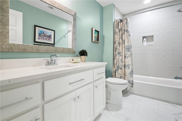 full bathroom with vanity, shower / tub combo, and toilet