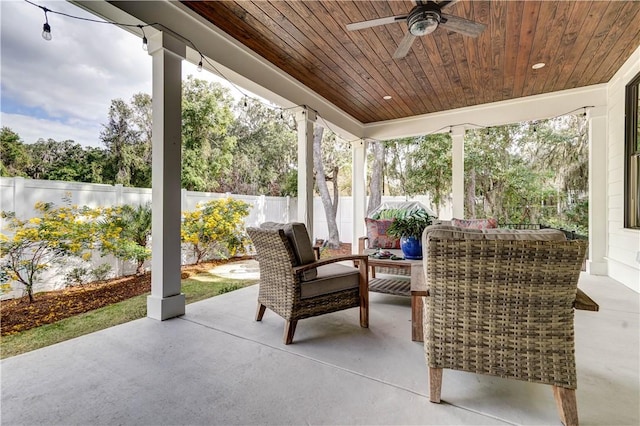 view of patio with ceiling fan and an outdoor living space